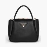 Prada Women Small leather handbag with the Prada Metal Lettering Logo Illuminating Its Center